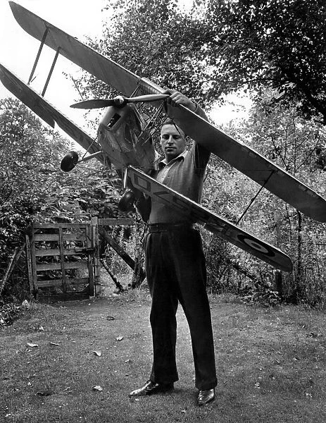 Man with radio controlledmodel of a Tiger Moth Aircraft. Circa 1960 P001060