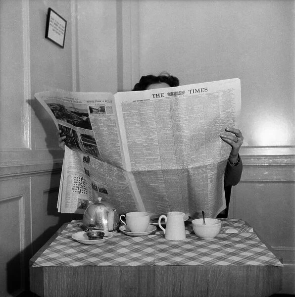 Man reading the Times newspaper. April 1953 D1955