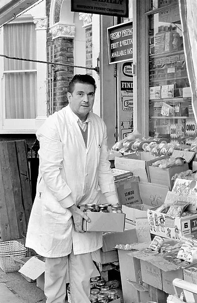 A man sitting in his shop at Deptford. November 1969 Z10715-001