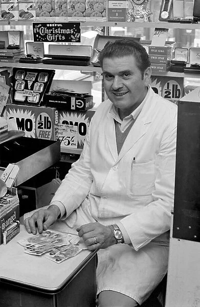 A man sitting in his shop at Deptford. November 1969 Z10715
