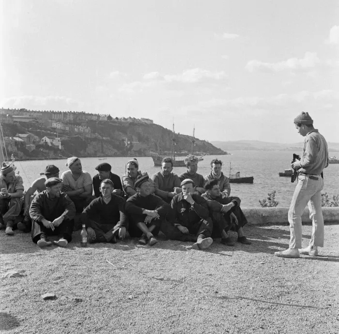 Framed Print : A man takes a photo of a group of men at Brixham Harbour, Devon. 12th April 1957 Framed Print : A man takes a photo of a group of men at Brixham Harbour, Devon. 12th April 1957