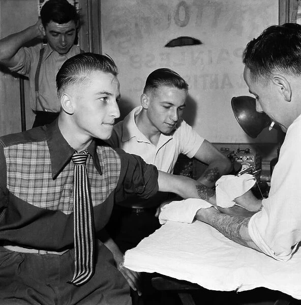 A man being Tattooed. August 1953 D5313