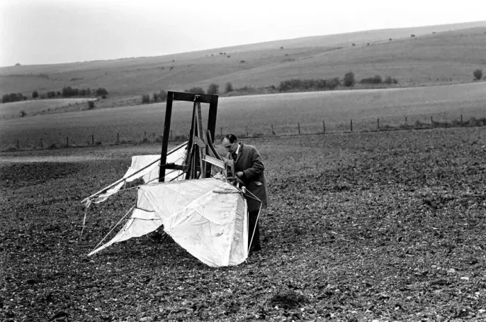 Framed Print : A man trues out his home made flying machine in a field in Wiltshire Framed Print : A man trues out his home made flying machine in a field in Wiltshire