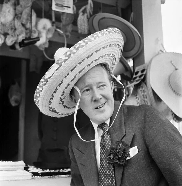 Man wearing hat at Battersea Pleasure fair June 1952. August 1952 C2976-004