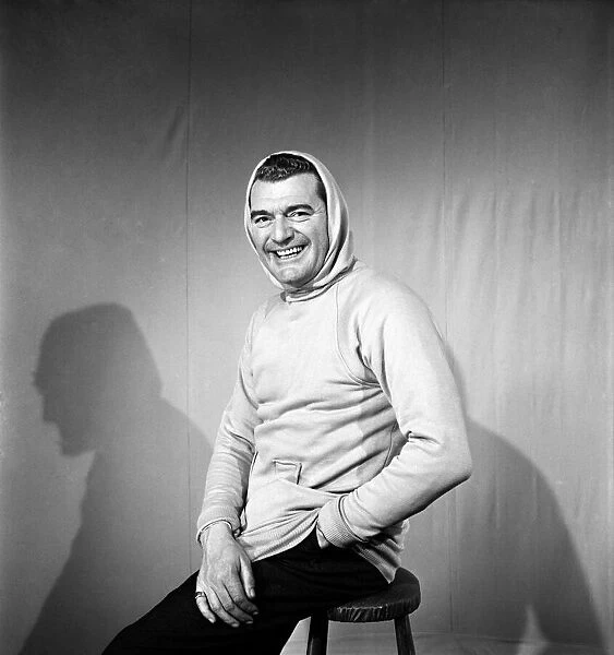 Man wearing a hooded pullover. January 1953 D536-001
