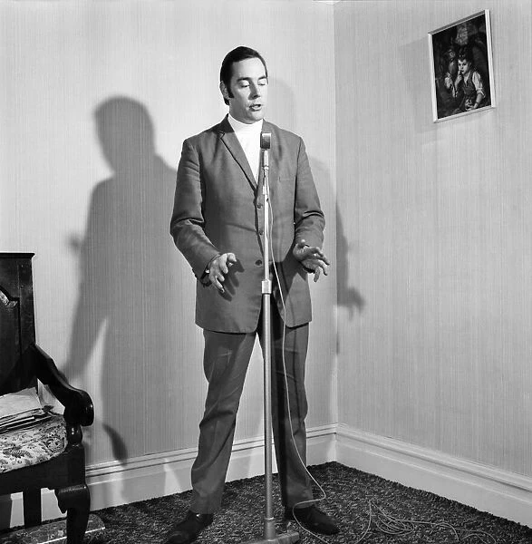 A man wearing a suit singing into a microphone. November 1969 Z10935-020