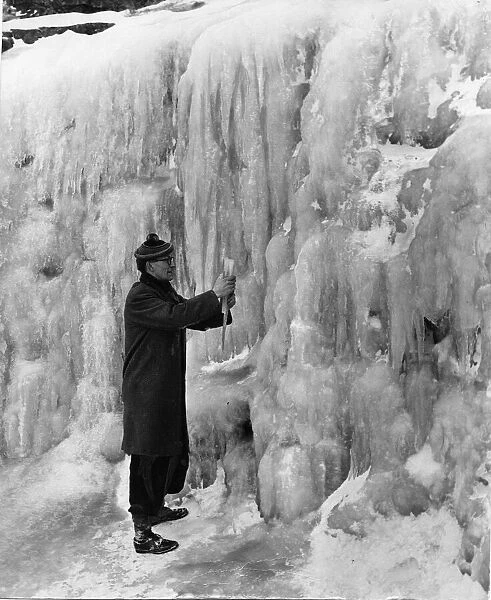 This man, who is over six feet tall, was photographed against one of the frozen