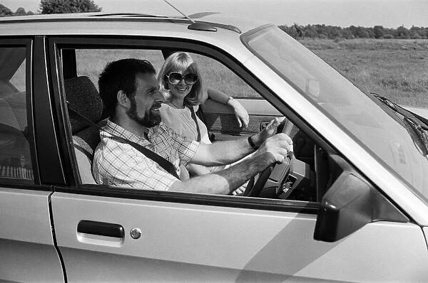 A man and woman in a MG Maestro. 8th June 1983