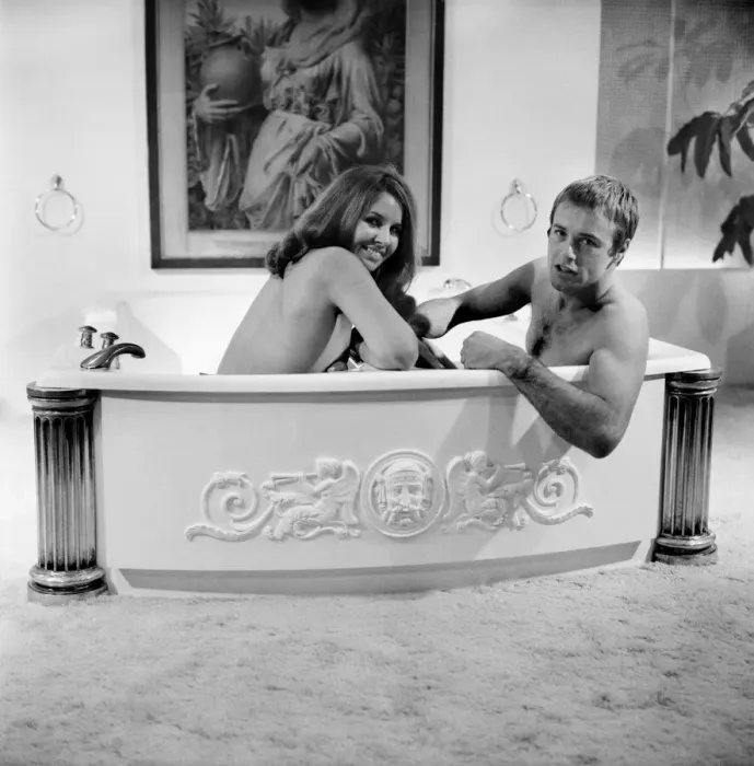 Framed Print : Man and woman sharing a bath designed for two. November 1969 Z10586-005