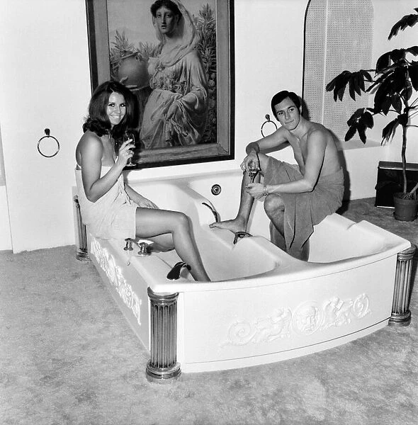 Man and woman sharing a bath designed for two. November 1969 Z10586-002