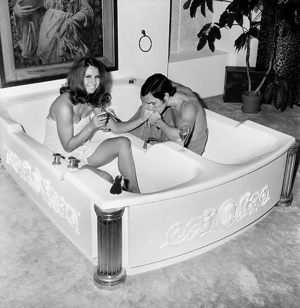 Man and woman sharing a bath designed for two. November 1969 Z10586-001