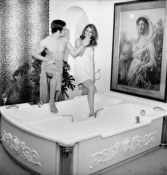 Man and woman sharing a bath designed for two. November 1969 Z10586