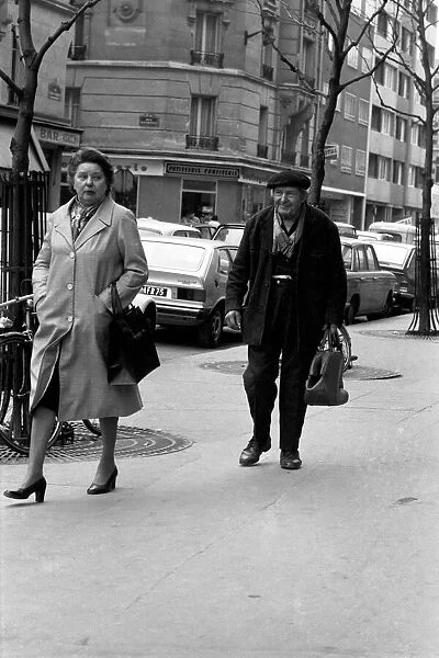 Man and woman walking down the street in Paris, France. April 1975 75-2079-009