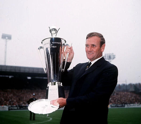 Manager of Leeds United Football Club Don Revie with the Manager of the Year Trophy