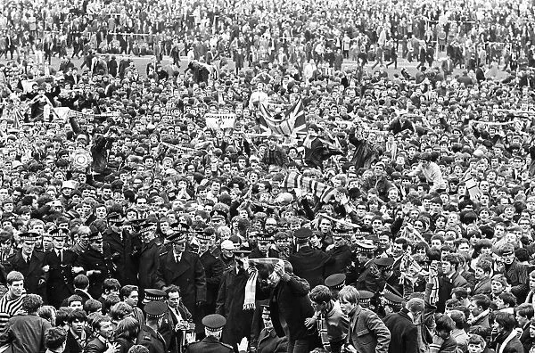 Manchester City fans celebrate after their team sealed the League title with a 3-4