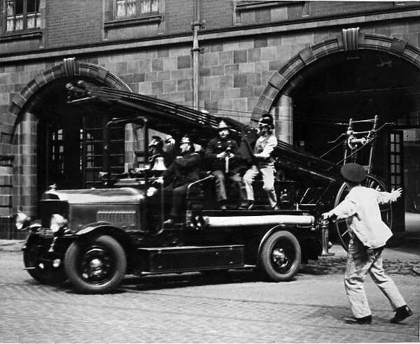 Manchester City Fire Brigade. A Fire Engine leaves the Manchester City Fire Brigade