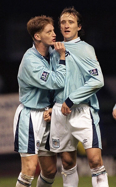 Manchester City footballers Steve Lomas and Nicky Summerbee celebrate a goal during their