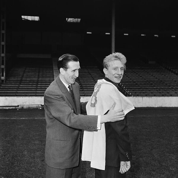 Manchester City new signing Denis Law with Ken Barnes trying his new shirt for size