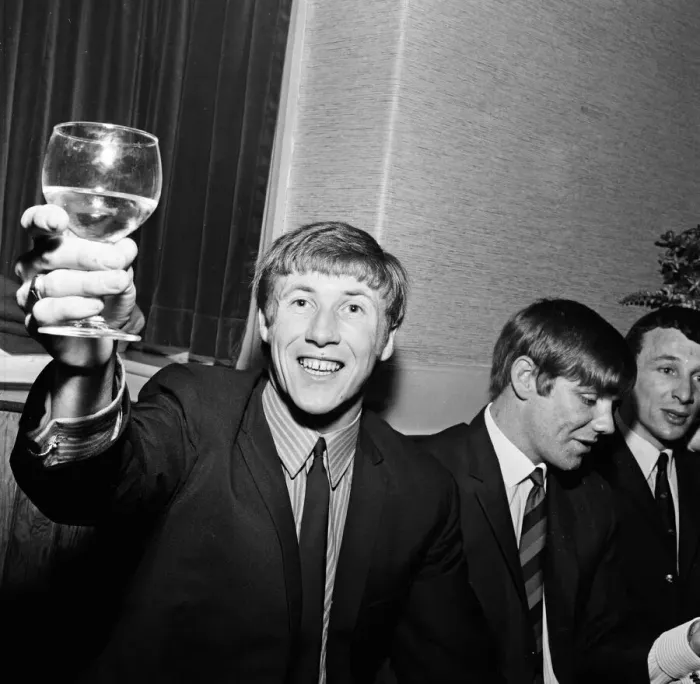 Framed Print : Manchester City players and management staff celebrate with a few drinks