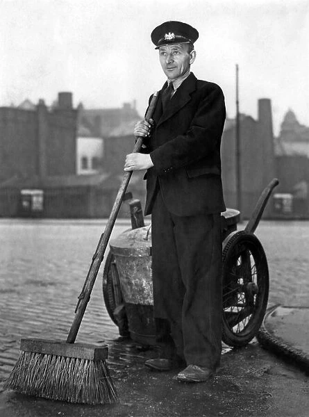 A Manchester road sweeper seen here showing of his new uniform. March 1951 P000234
