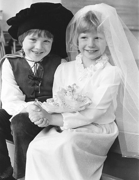 Manchester schoolchildren dressed as a happy couple on their wedding day for