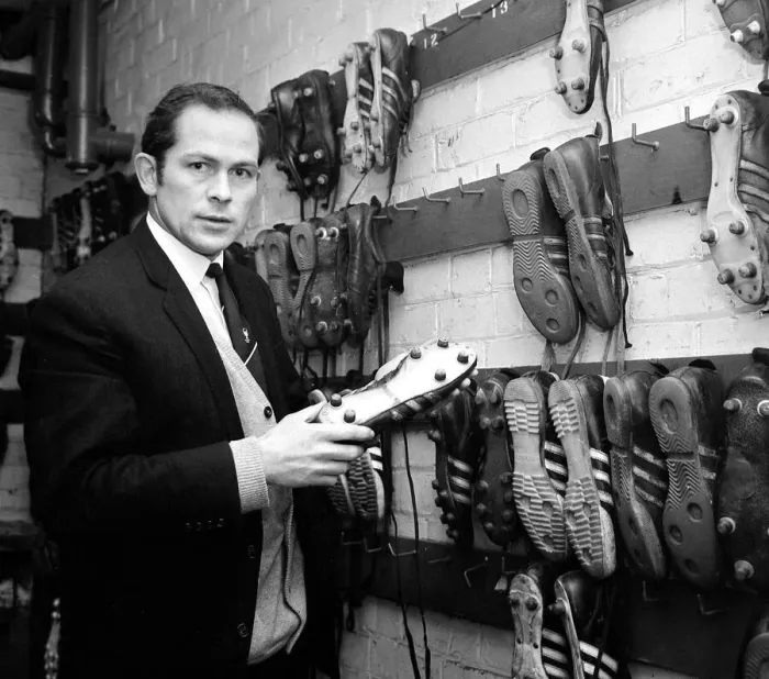Framed Print : Manchester United assistant trainer Wilf McGuinness inspects one of the five types of Framed Print : Manchester United assistant trainer Wilf McGuinness inspects one of the five types of