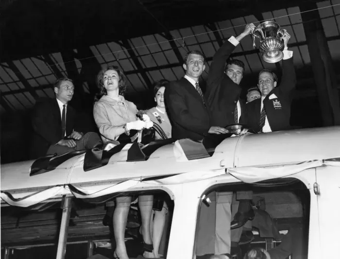 Framed Print : Manchester United captain Noel Cantwell (right) proudly holds aloft the FA Cup trophy to