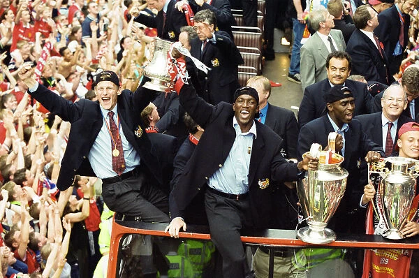 Manchester United celebrate winning the treble as the jubilant team make their way