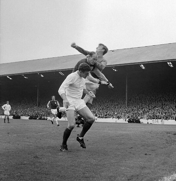Manchester United centre-half Bill Foulkes and keeper Alex Stepney in action clearing a