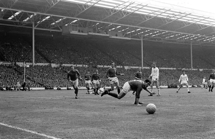 Framed Print : Manchester United defence watch the ball go to safety during the Manchester United