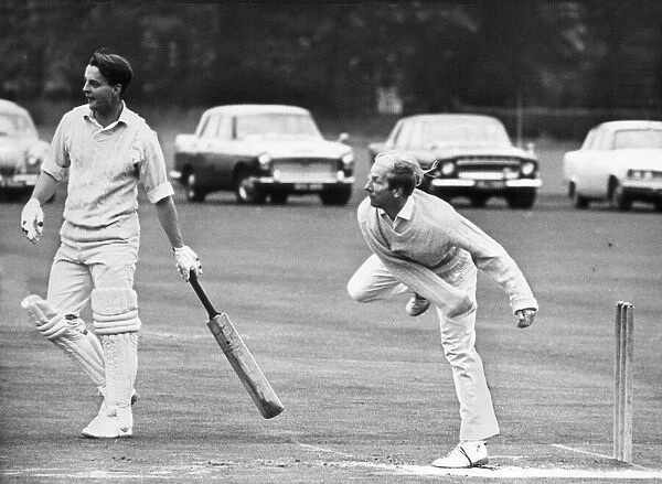 Manchester United and England footballer Bobby Charlton bowling to take two wickets in