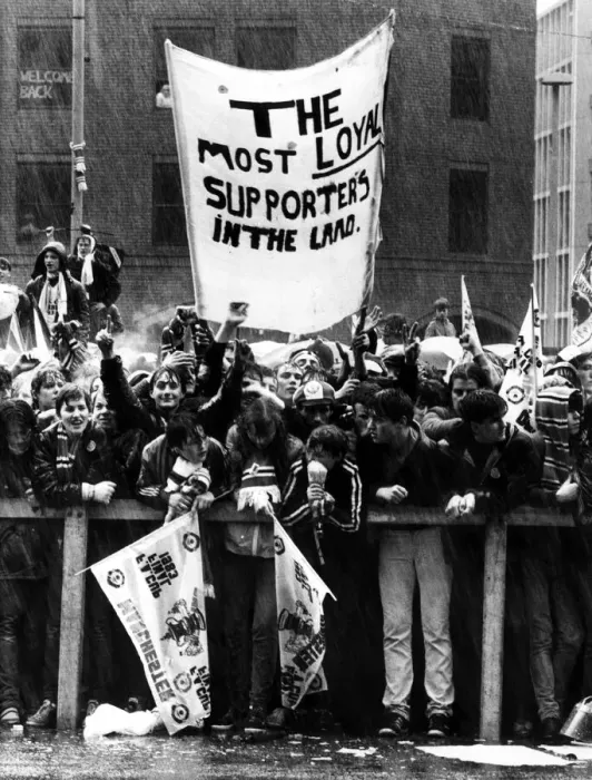 Framed Print : Manchester United fans line the streets as they await the return of their team following Framed Print : Manchester United fans line the streets as they await the return of their team following
