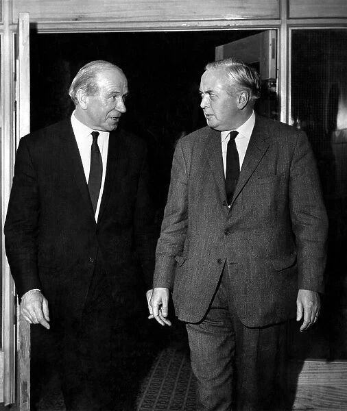 Manchester United football manager Matt Busby meets Prime Minister Harold Wilson for