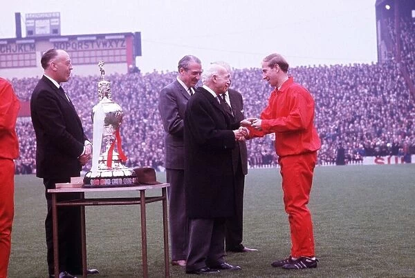 Manchester United footballer Bobby Charlton receives his medal at the Football League