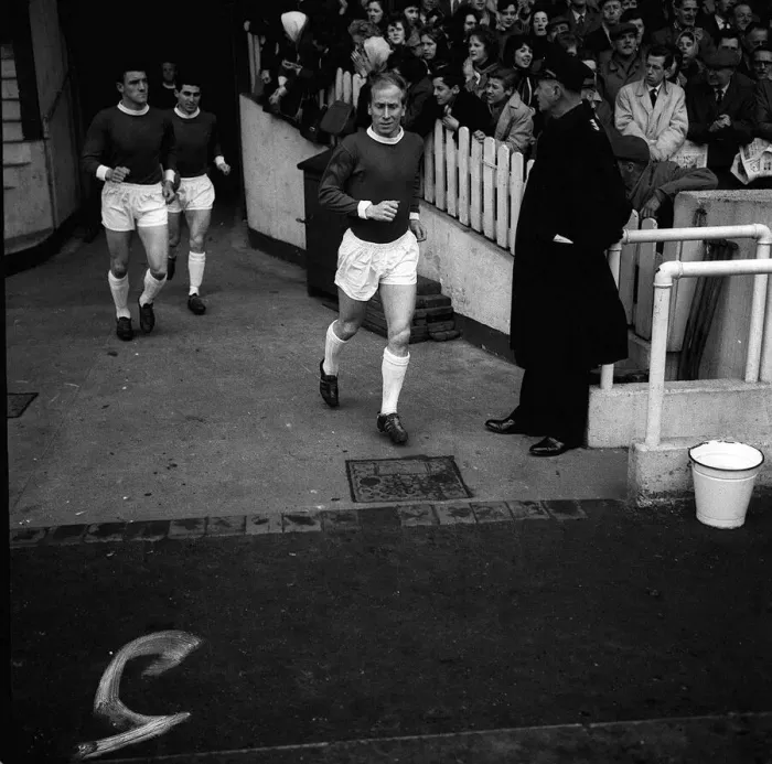 Framed Print : Manchester United footballer Bobby Charlton runs out on to the pitch for the league match Framed Print : Manchester United footballer Bobby Charlton runs out on to the pitch for the league match