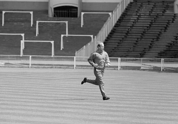 Manchester United footballer Bobby Charlton warms up at an empty Wembley Stadium prior to