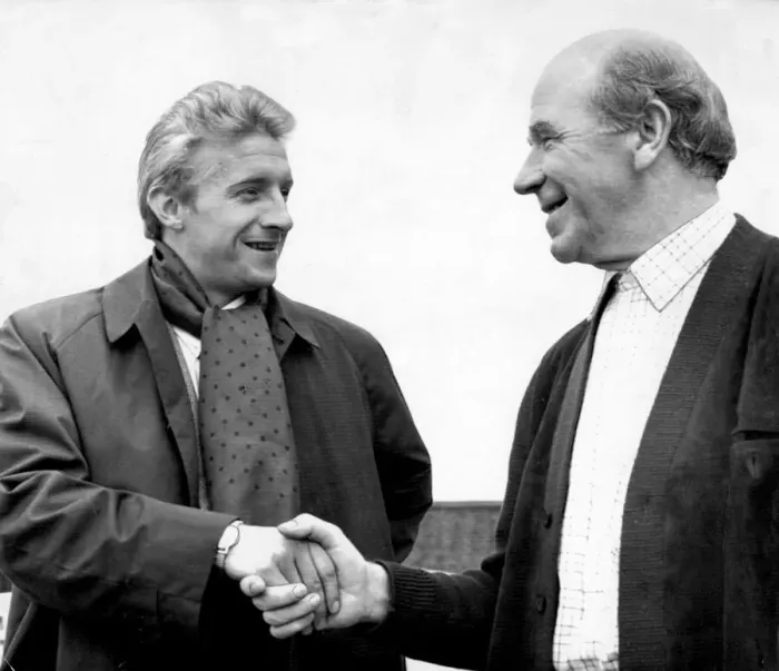 Framed Print : Manchester United footballer Denis Law shakes hands with his manager Matt Busby at Old Framed Print : Manchester United footballer Denis Law shakes hands with his manager Matt Busby at Old