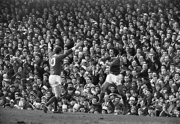 Manchester United footballer George Best celebrates after scoring the third goal against