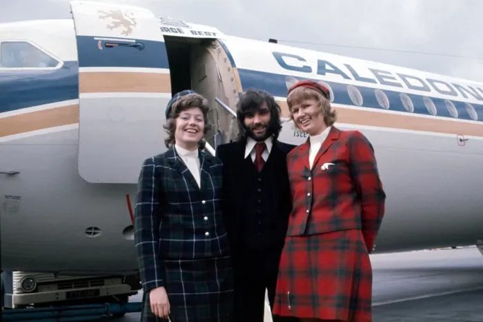 Framed Print : Manchester United footballer George Best with air hostesses before boarding his plane