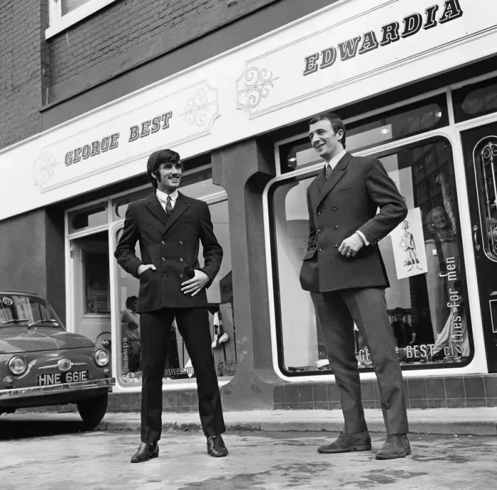 Framed Print : Manchester United footballer George Best celebrates the opening of his fashion boutique
