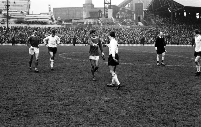 Framed Print : Manchester United footballer George Best with a football boot in his hand