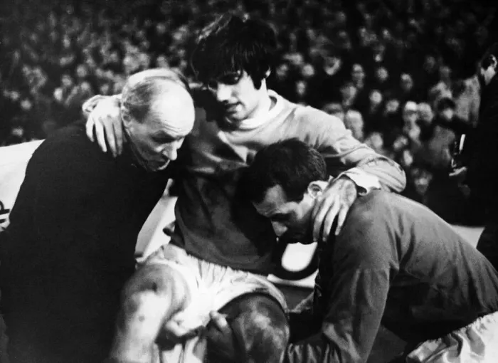 Framed Print : Manchester United footballer George Best is helped off the pitch by trainer Jack Framed Print : Manchester United footballer George Best is helped off the pitch by trainer Jack