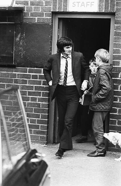Manchester United footballer George Best leaving Old Trafford after receiving treatment