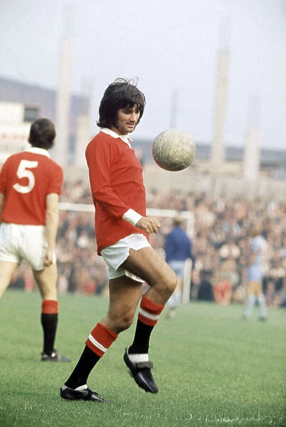 Manchester United footballer George Best warming up ahead of his side