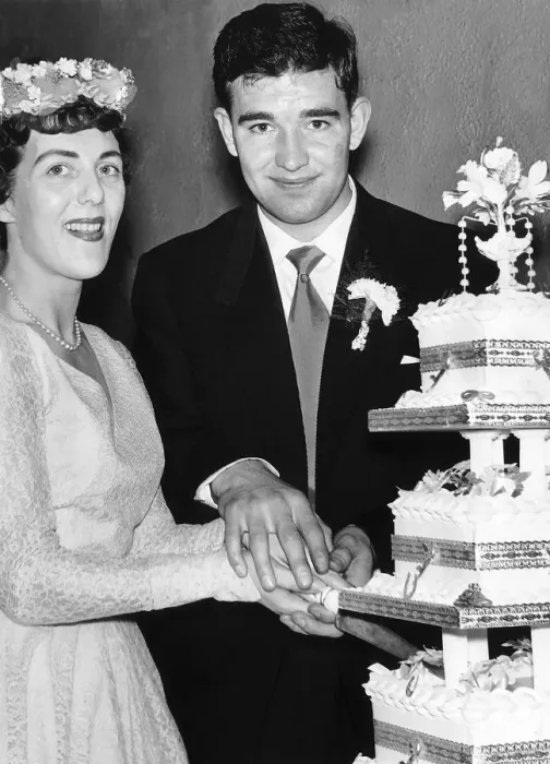 Framed Print : Manchester United footballer Jackie Blanchflower cuts the wedding cake on his wedding day