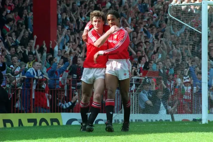 Framed Print : Manchester United footballer Mark Hugfhes celebrates a goal with teammate Paul Ince