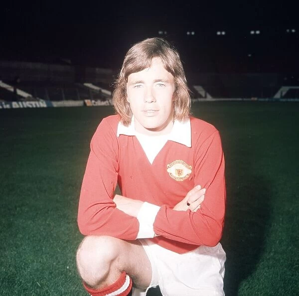 Manchester United footballer Sammy McIlroy poses during a pre season photocall at Old