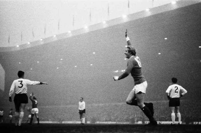 Framed Print : Manchester United forward Denis Law celebrates after he scored the game Framed Print : Manchester United forward Denis Law celebrates after he scored the game
