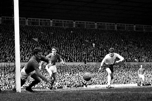 Manchester United goalkeeper Alec Stepney flings himself at the ball to save a fierce