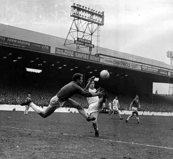 Manchester United goalkeeper Harry Gregg gets to the ball before Manchester City